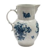 A Caughley blue and white cabbage leaf jug: with mask spout,