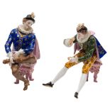 A pair of Continental porcelain figures: of 'Elizabethan' gentleman modelled seated on stools and