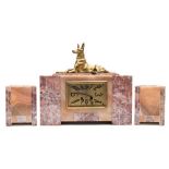A marble and bronze Art Deco clock garniture: the eight-day duration French movement striking the