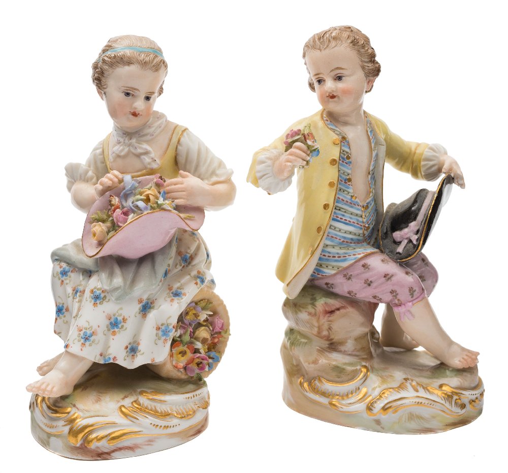 A pair of Meissen figures of gardeners' children after Kandler: the girl with flowers in her bonnet