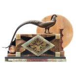 A marble and bronze Art Deco mantel clock: the eight-day duration French movement striking the