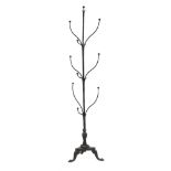 A wrought iron 'tree' hat stand:, with curved branches and stylised leaf decoration,