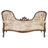 A Victorian carved walnut settee:,