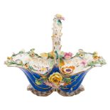 A Coalport porcelain flower basket: of typical rococo form with blue and gilt exterior,