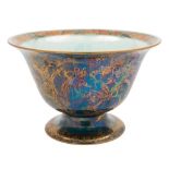 A Wedgwood fairyland lustre pedestal bowl: the exterior decorated with the 'Firbolgs' pattern,