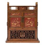 A Chinese wood, red lacquer and gilt decorated brass mounted floor cabinet:,