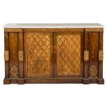 A Regency rosewood, carved giltwood and brass mounted side cabinet:, of breakfront outline,