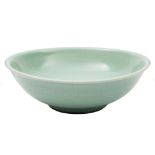 A Chinese celadon bowl: of curved shallow form with everted rim,