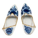 A pair of Meissen porcelain models of Persian-style slippers: decorated in underglaze blue, green,