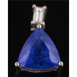 A trillion-cut tanzanite and baguette-cut diamond two-stone pendant: the trillion-cut tanzanite