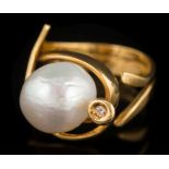 A Portuguese freshwater cultured pearl and diamond set ring: the baroque cultured pearl