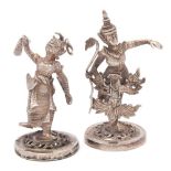 A pair of Burmese silver novelty menu or place name holders: modelled in the form of dancers in