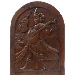 A carved oak domed panel: depicting Orpheus playing a lute, carved in low relief, 46.5cm x 34cm.