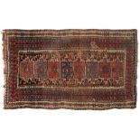 A Shirvan rug:, the field with eight rectangular panels,