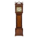 Fearnly, Wigan an oak longcase clock: the eight-day duration movement striking the hours on a bell,