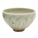 A small Chinese celadon bowl: the exterior moulded with lotus leaves, probably Song Dynasty,
