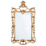 A 19th Century carved giltwood mirror:, of cartouche shaped outline, with palmette,