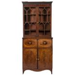 An early 19th Century mahogany and inlaid secretaire bookcase:,