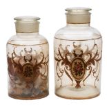 A pair of late 19th Century glass shop window jars and covers: each with gilt cartouches containing