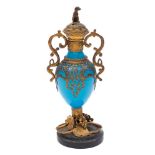 A Continental blue glass and gilt-metal mounted scent bottle: with seated dog finial,