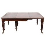 A Victorian mahogany extending dining table:, with a telescopic action,