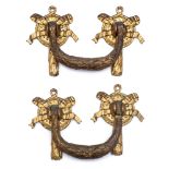 A pair of 19th century ormolu mounted handles: of tied garland design, with ribbon tied backplates.