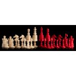 A 19th century Indian ivory Barleycorn style pattern chess set: one side stained red the other side