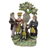 A Staffordshire pearlware 'New Marriage Act' group: of traditional form,