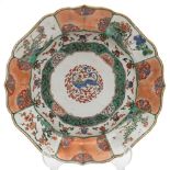 A Chinese famille verte lotus form dish: finely painted with a mythical beast to the centre within