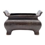 A Chinese bronze censer: of compressed rectangular shape with flared rim, six-character Xuande mark,