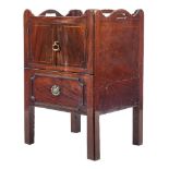 A George III mahogany and inlaid tray top commode:, the shaped gallery with carrying handles,