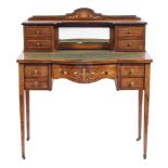 A lady's Edwardian rosewood and marquetry writing table:, of bowed breakfront outline,