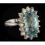 An aquamarine and diamond oval cluster ring: the oval aquamarine approximately 15mm wide x 9mm wide