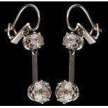 A pair of diamond two-stone drop earrings: each with a round old,