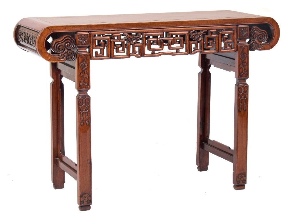 A Chinese Hua Li Wood altar table:, the plain rectangular top with curved ends,