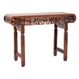 A Chinese Hua Li Wood altar table:, the plain rectangular top with curved ends,