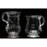 Two English glass tankards: one of bell shaped form with exterior basal ribs and set on a flaring