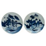 Two Chinese porcelain shallow dishes: each painted in blue, one with a pair of horses and a bat ,