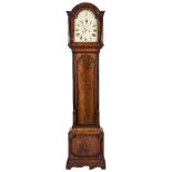 A Georgian mahogany longcase clock: the eight-day duration movement striking the hours on a bell,