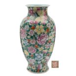 A Chinese famille rose millefleur vase: of baluster form with waisted neck and everted rim,