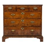 An early 18th Century walnut veneer and cross and feather banded rectangular chest:,