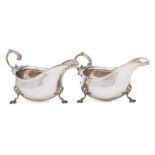 A pair of George V silver sauceboats, maker Asprey & Co, London, 1916: with wavy edge border,