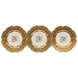 A set of ten Dresden 'jewelled' and monogrammed cabinet plates: the shaped rims with iron-red