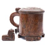 A 19th century Scandinavian lion peg tankard: the shallow domed hinged lid with carved low relief