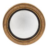 A Regency carved giltwood circular convex mirror:,