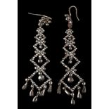 A pair of early 19th century cut-steel pendant earrings: set throughout with faceted steel studs,