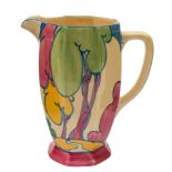 A Clarice Cliff Athens jug decorated in the Autumn (Balloon Trees) pattern: in green pink,