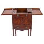 An early 19th Century mahogany and inlaid enclosed dressing table:,