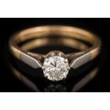 A diamond solitaire ring: the round brilliant-cut diamond 5.7mm diameter x 3.
