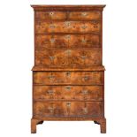 An early 18th Century walnut and crossbanded chest on chest:, the upper part with a moulded cornice,